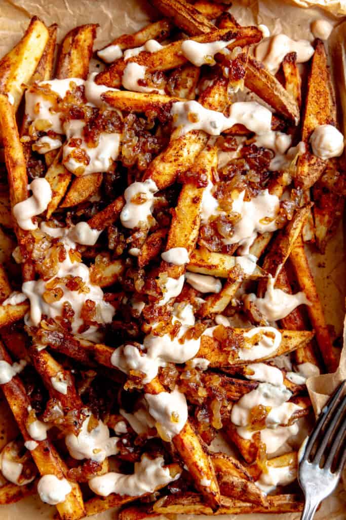 French fries covered in caramelized onions and thousand island dressing.