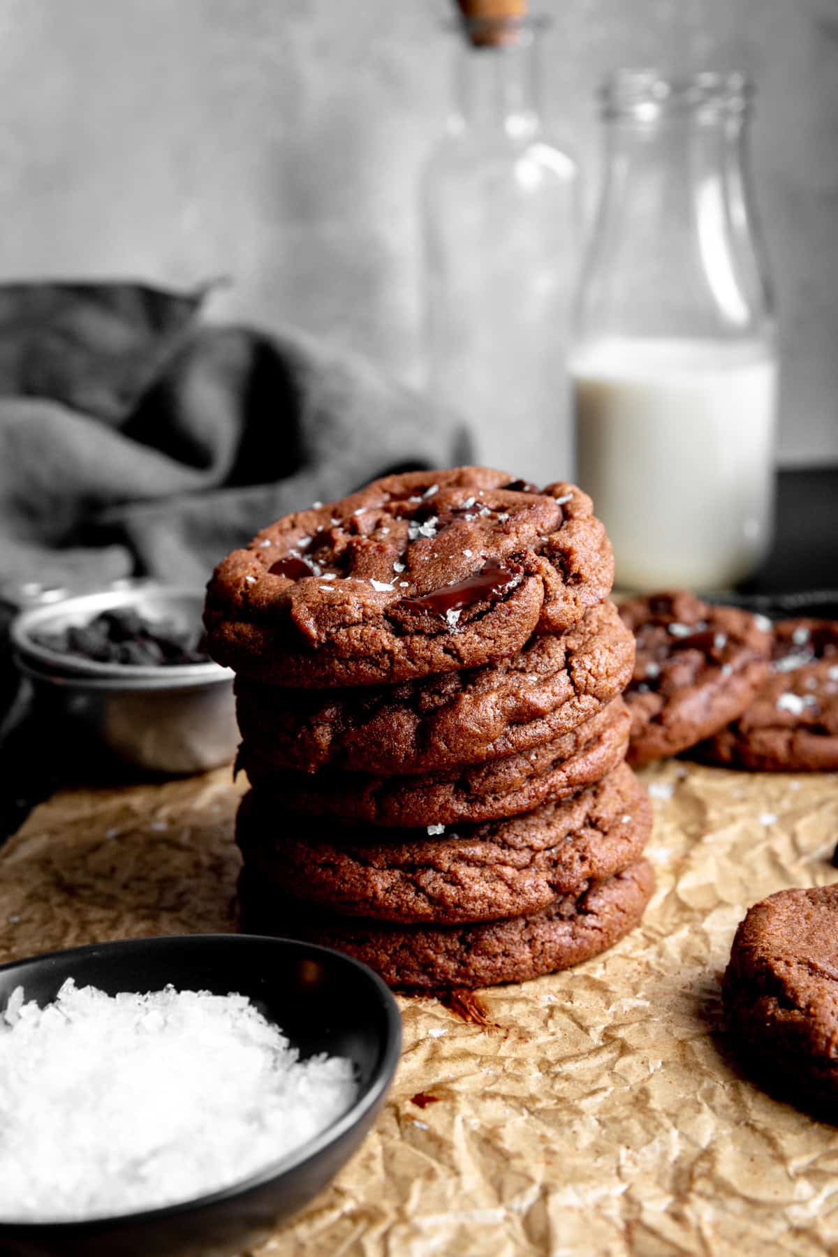 Stack of double chocolate cookies and a jug of milk.