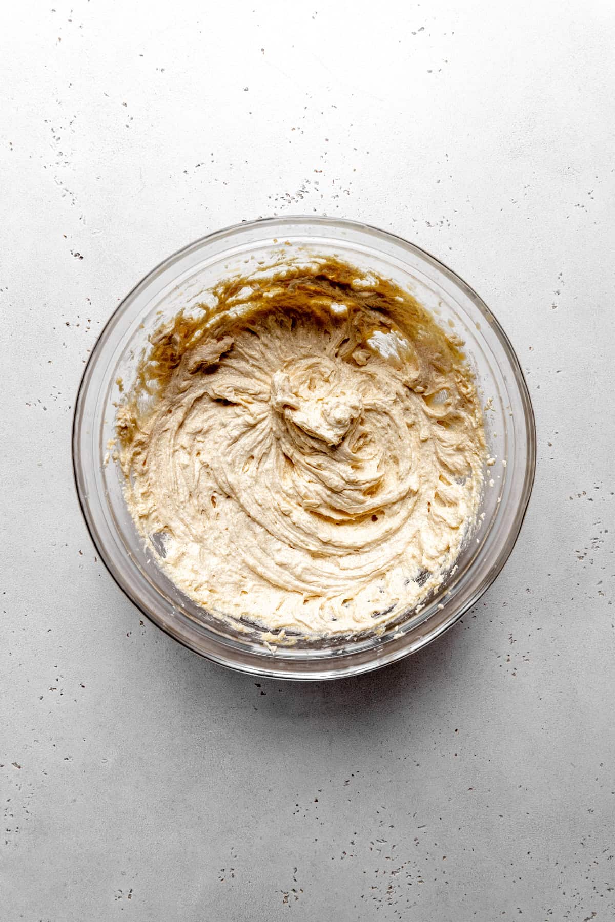 Creamed butter in a glass bowl.