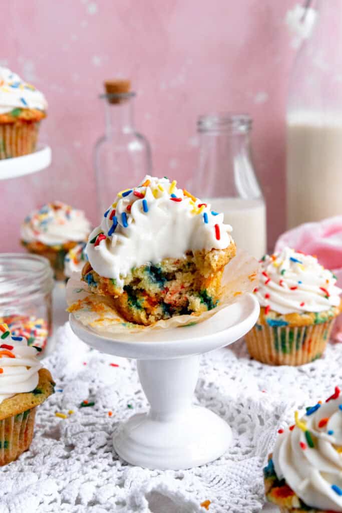 Fufnetti cupcake with a bite taken out of it.