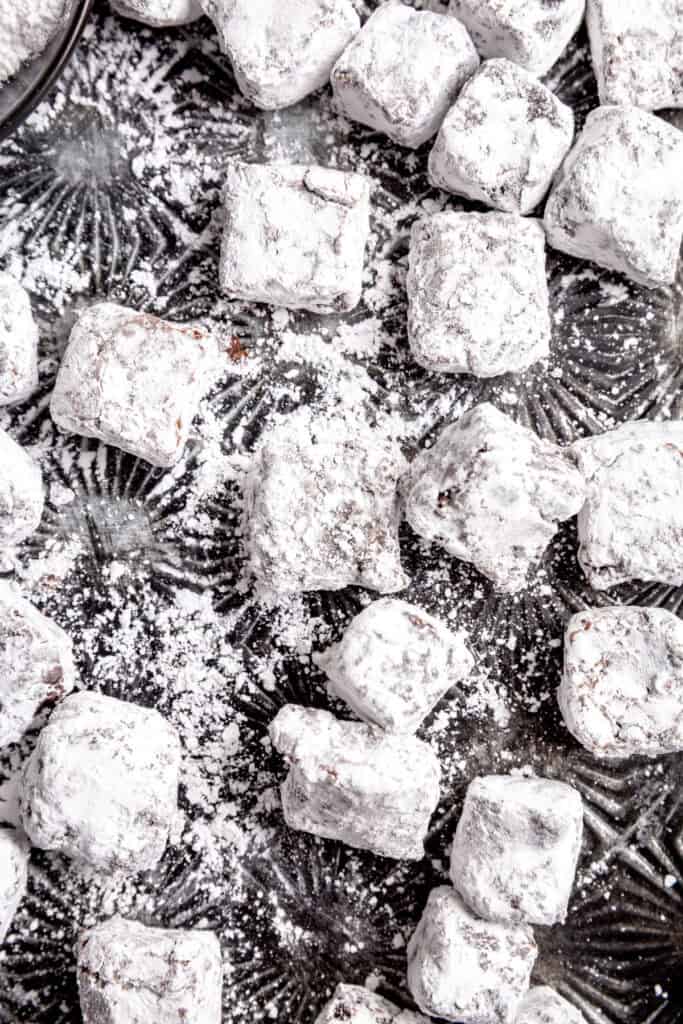Brownie bites coated in powdered sugar.