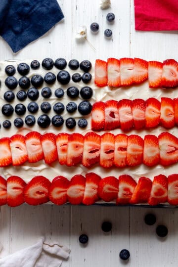 American flag cake and a knife covered in frosting.