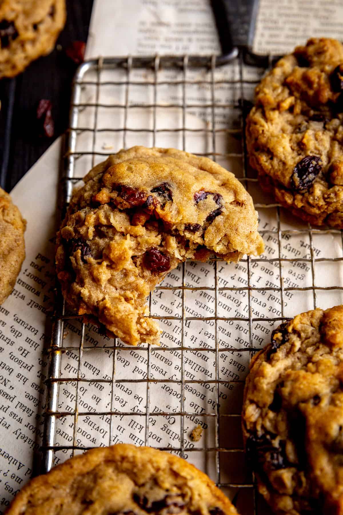 Oatmeal raisin cookie with a bite taken out of it.