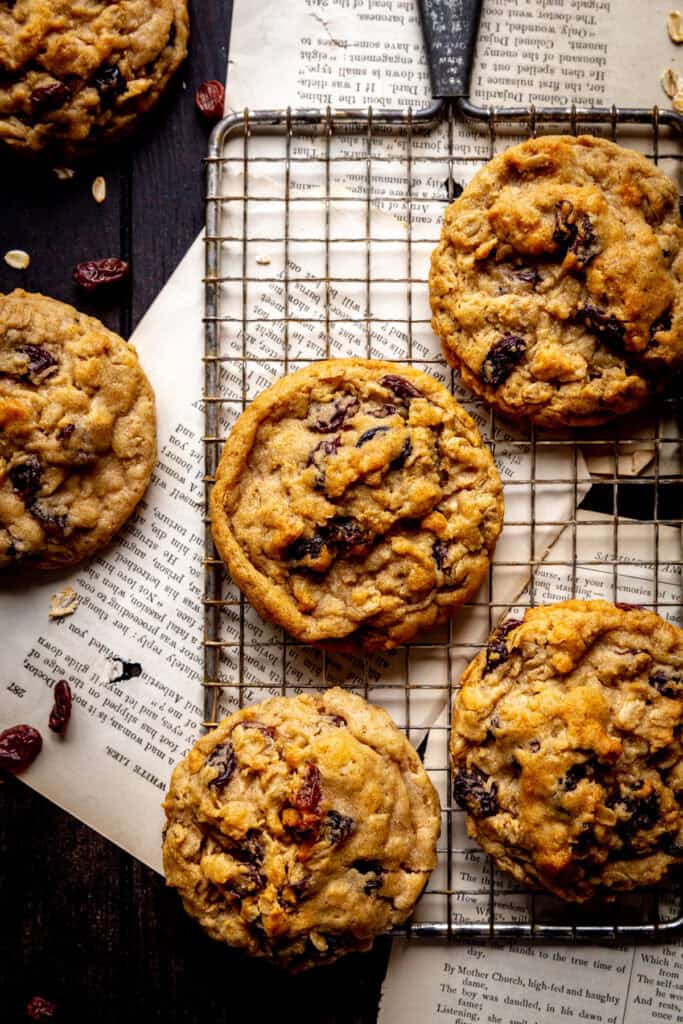 Oatmeal raisin cookies on a wire cooling rack.