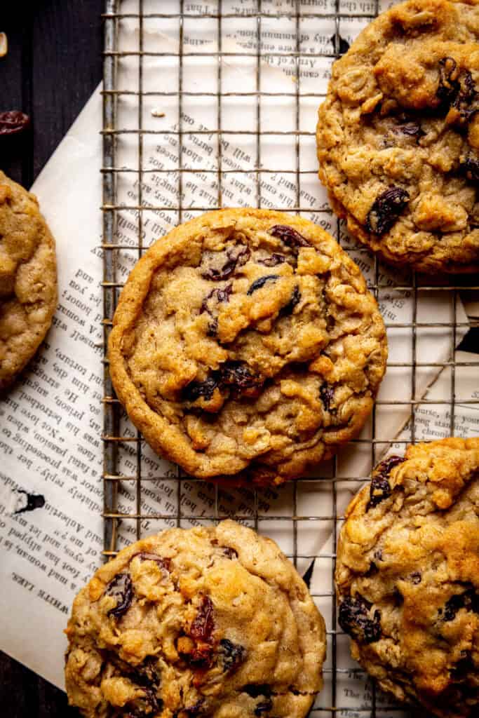 Oatmeal raisin cookies on a wire cooling rack.