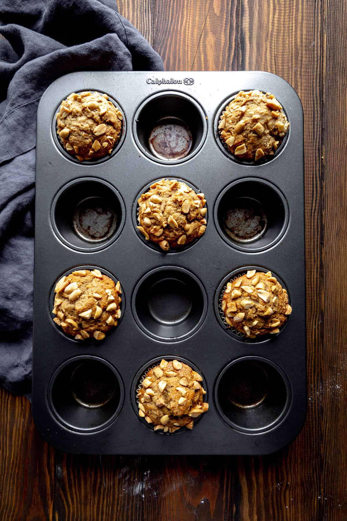 Baked peanut butter banana muffins in a cupcake pan.