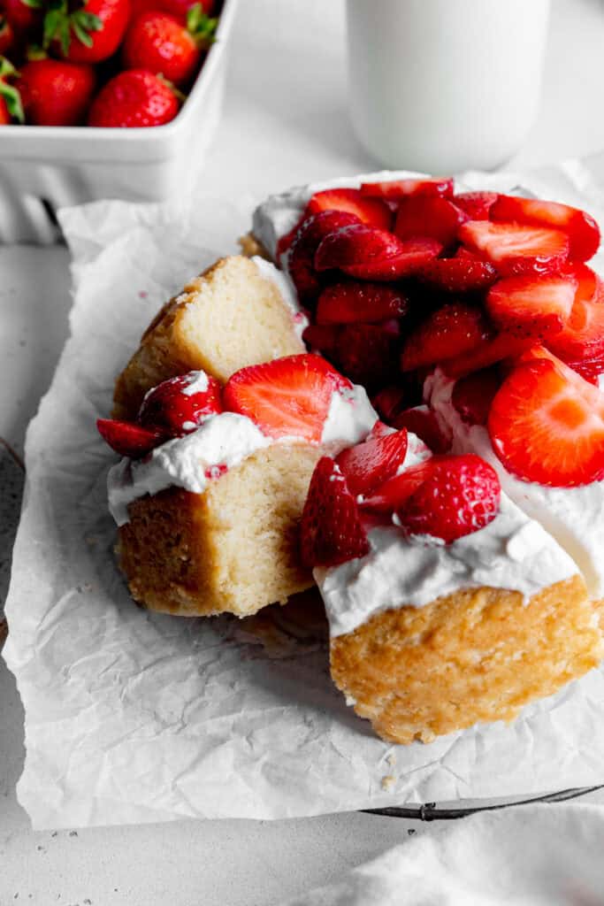 Slices of strawberry shortcake cake propped against each other.