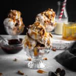 Scoops of caramel pretzel ice cream in a glass dish.