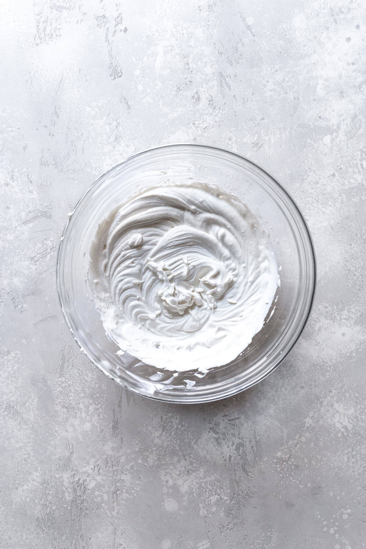 Glass bowl of whipped cream.