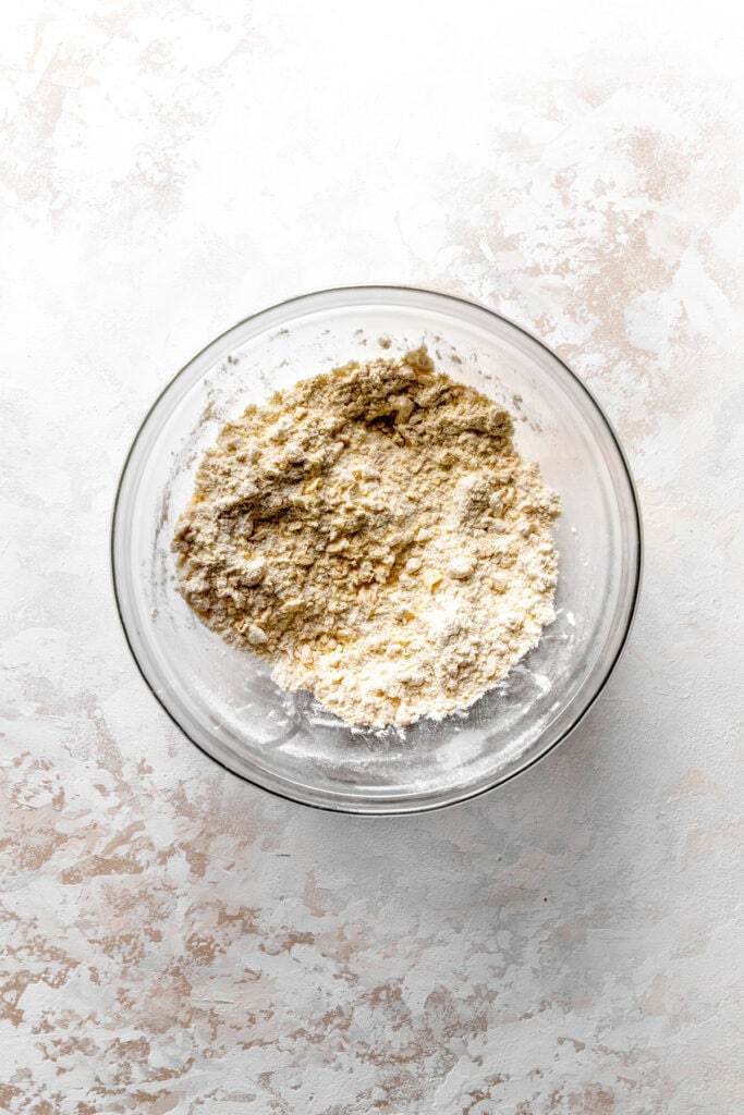 Glass bowl of flour, sugar and butter.