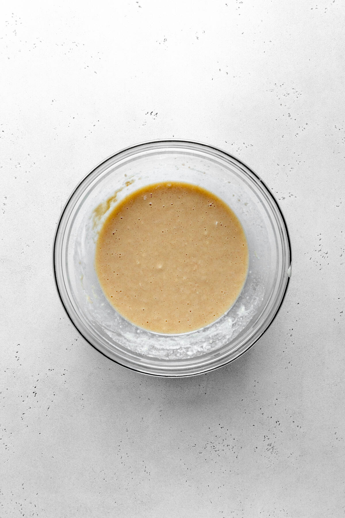 Glass bowl of cobbler batter.