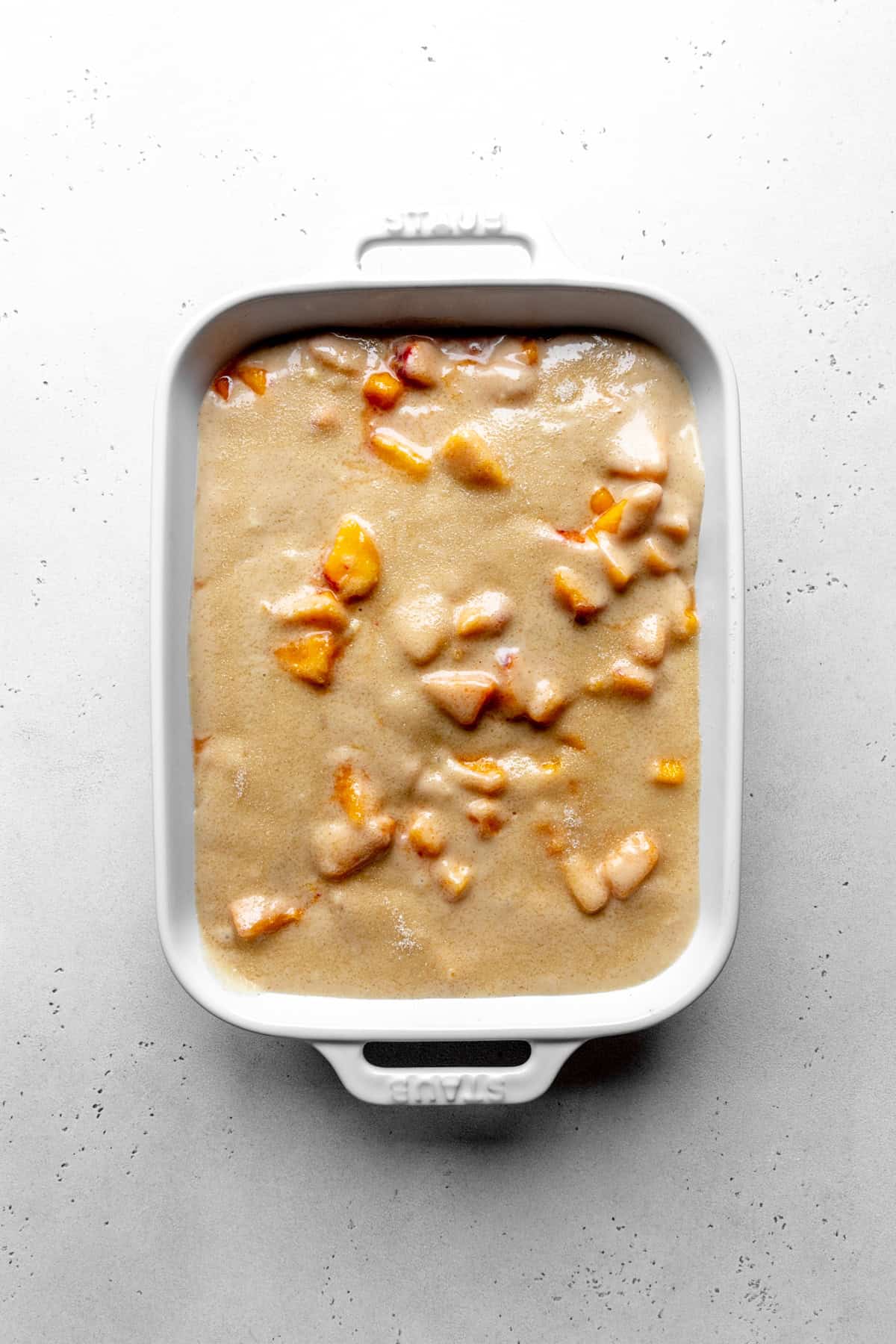 Unbaked peach cobbler.