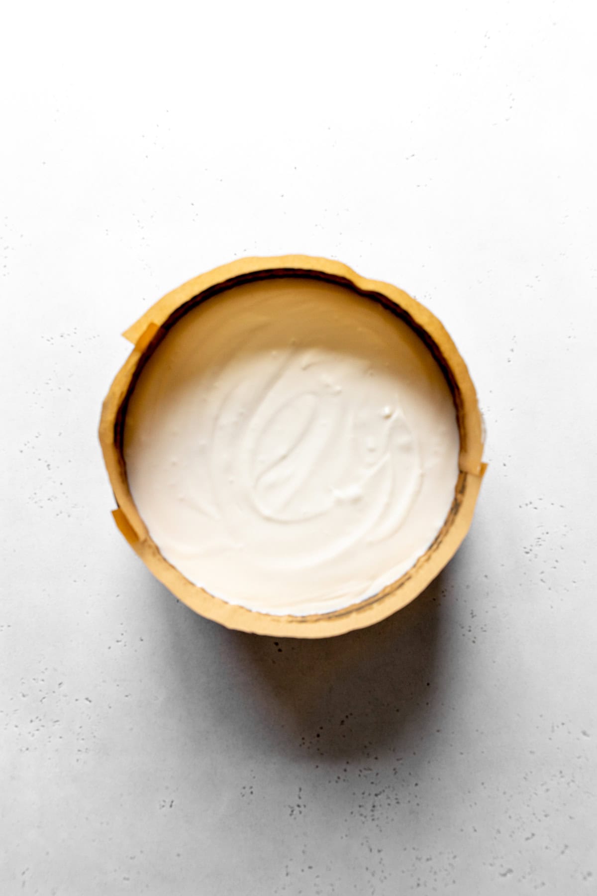Unbaked cheesecake in a springform pan.