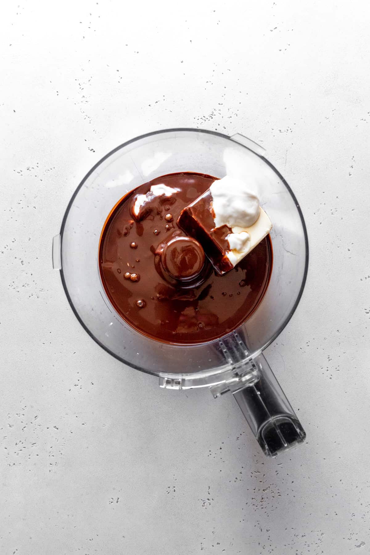 Food processor full of melted chocolate, silken tofu and yogurt.