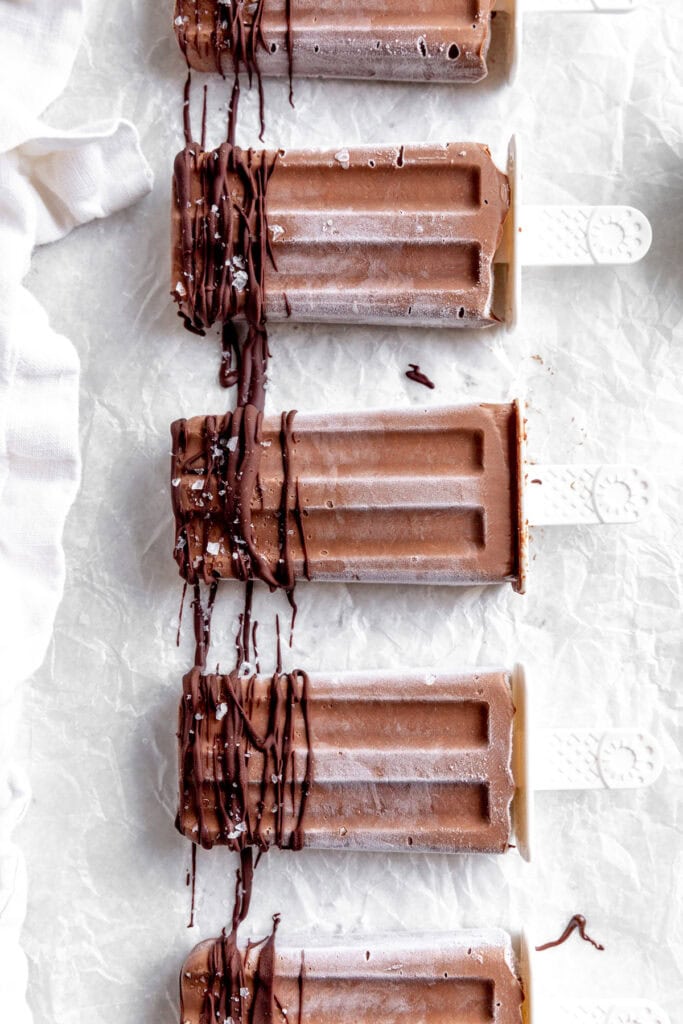Fudge pops drizzled with chocolate and sprinkled with sea salt.