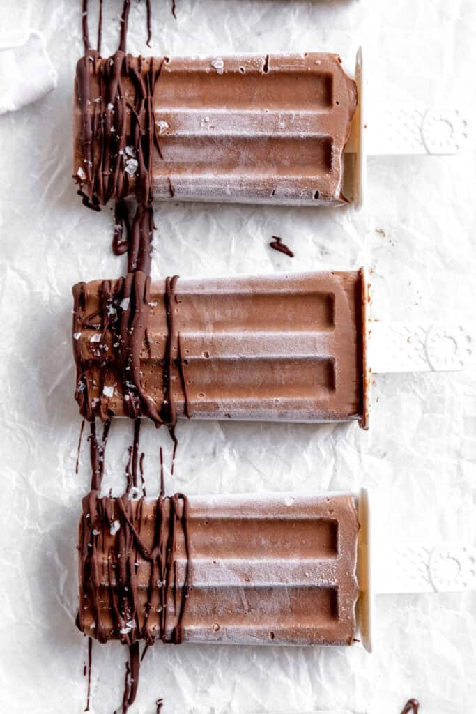 Fudge pops drizzled with chocolate.