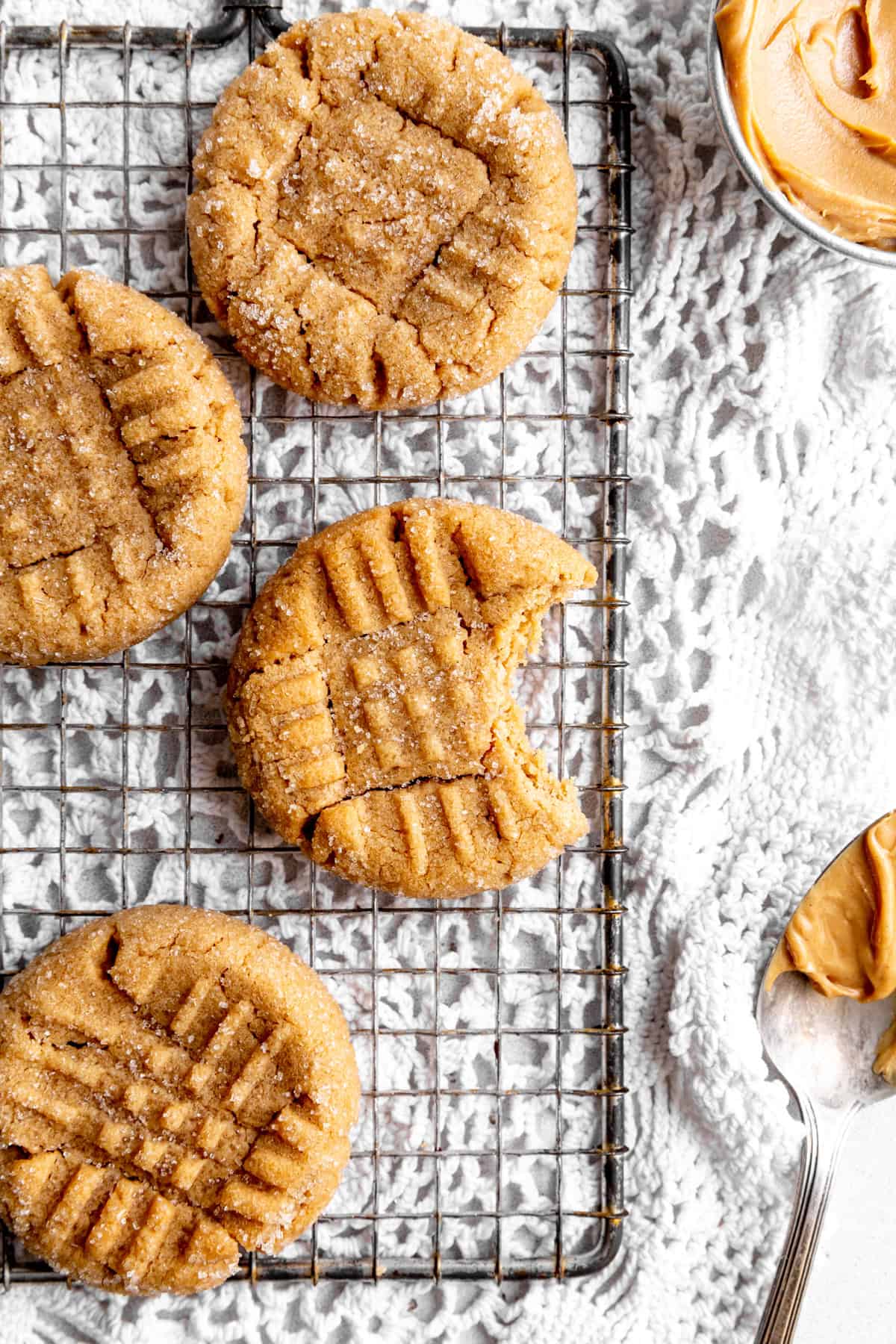 Peanut butter cookie with a bite taken out of it.