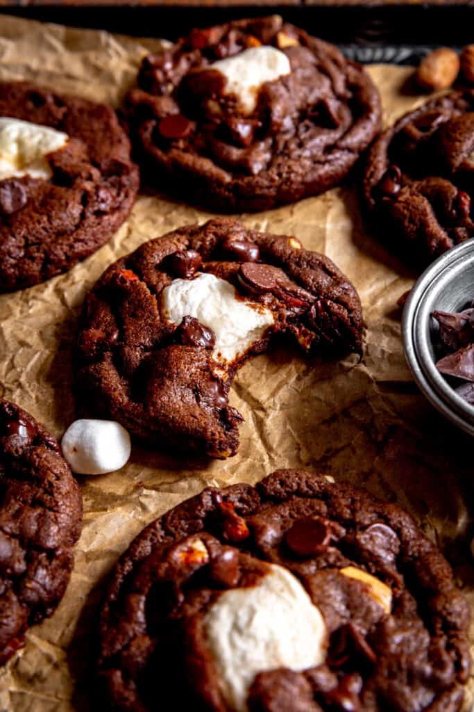 Rocky road cookie with a bite taken out of it.