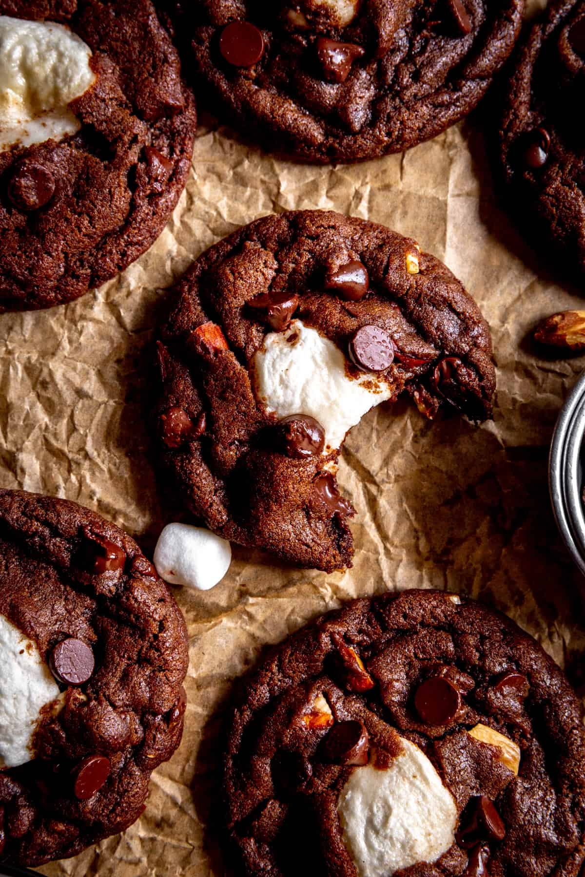 Rocky road cookie with a bite taken out of it.
