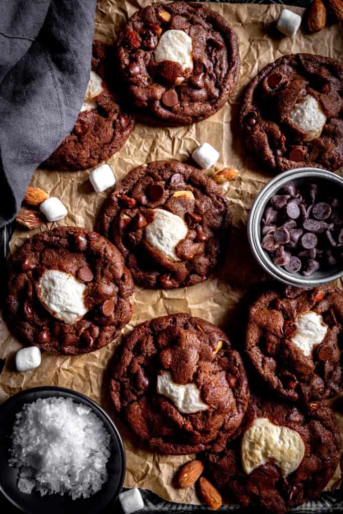 Rocky road cookies, a linen napkin and a cup of chocolate chips.