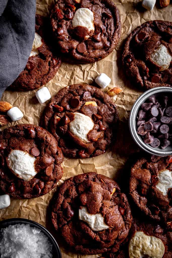 Rocky road cookies, a linen napkin and a cup of chocolate chips.