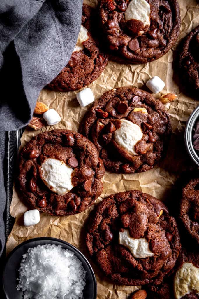 Rocky road cookies on parchment paper and a linen napkin.