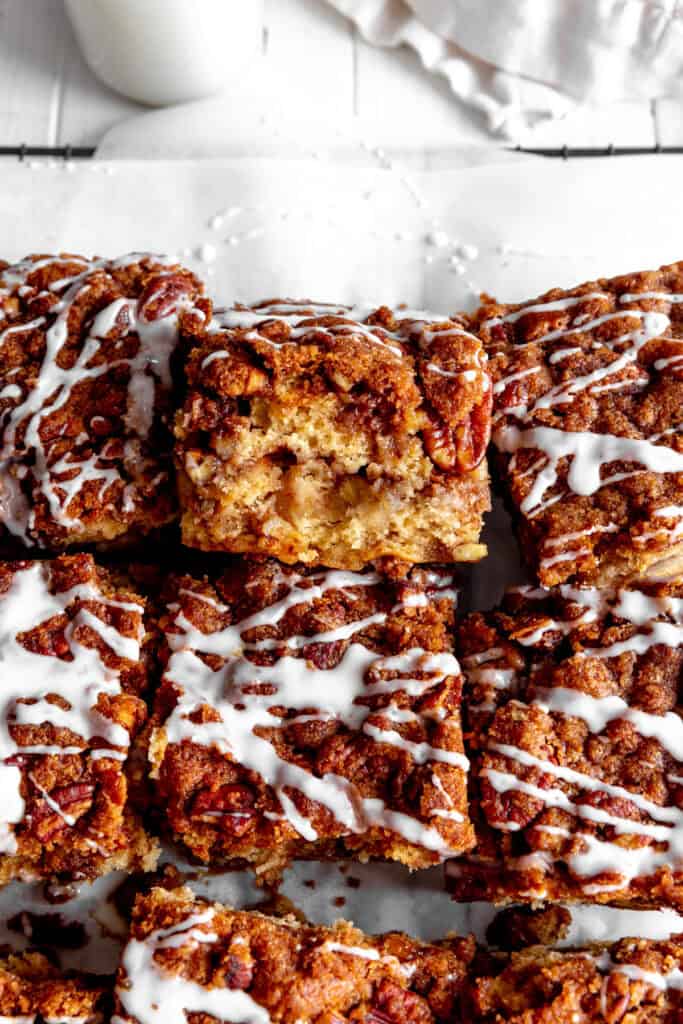 Slice of apple cinnamon coffee cake propped on it's side.