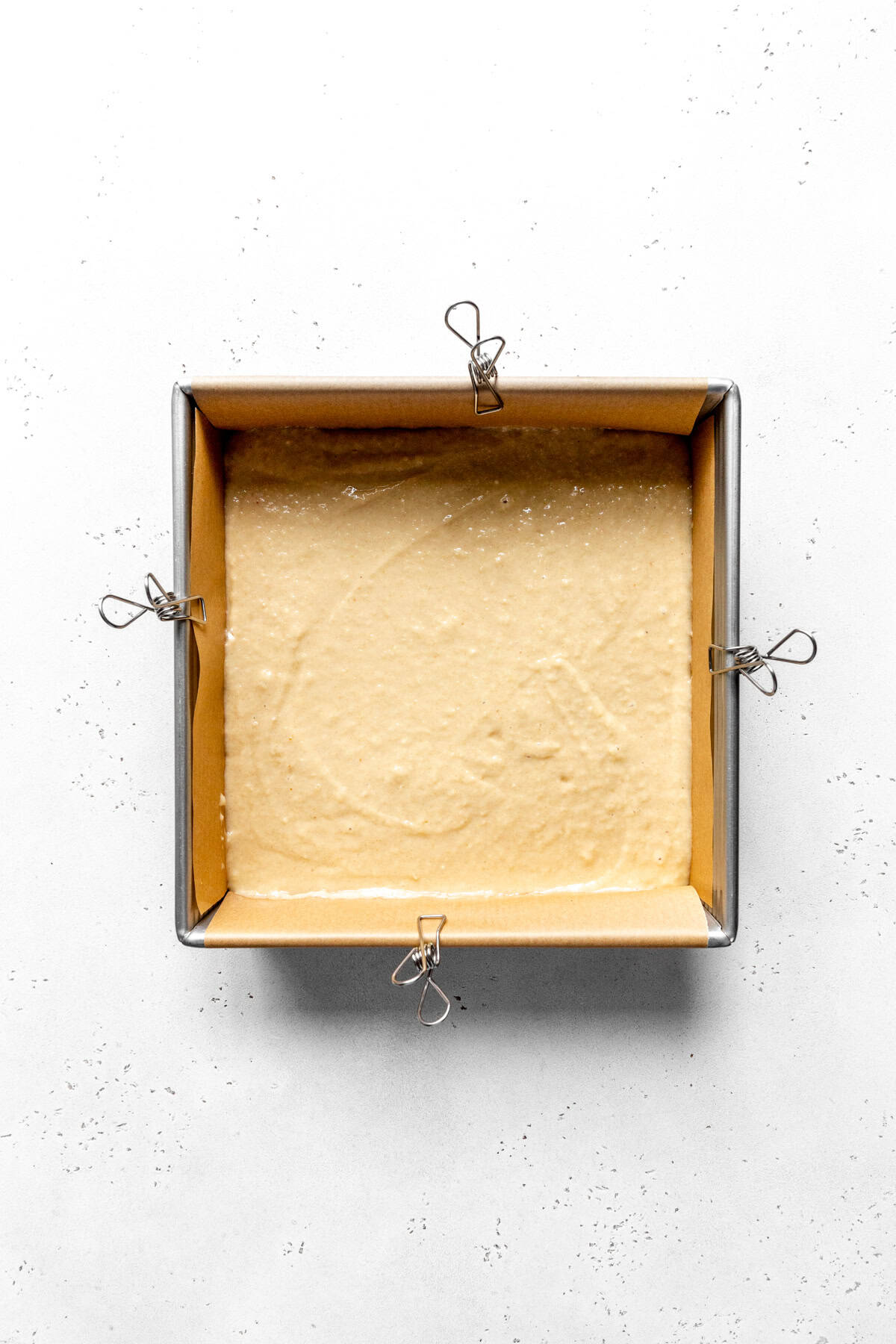 Coffee cake batter in a square baking pan.