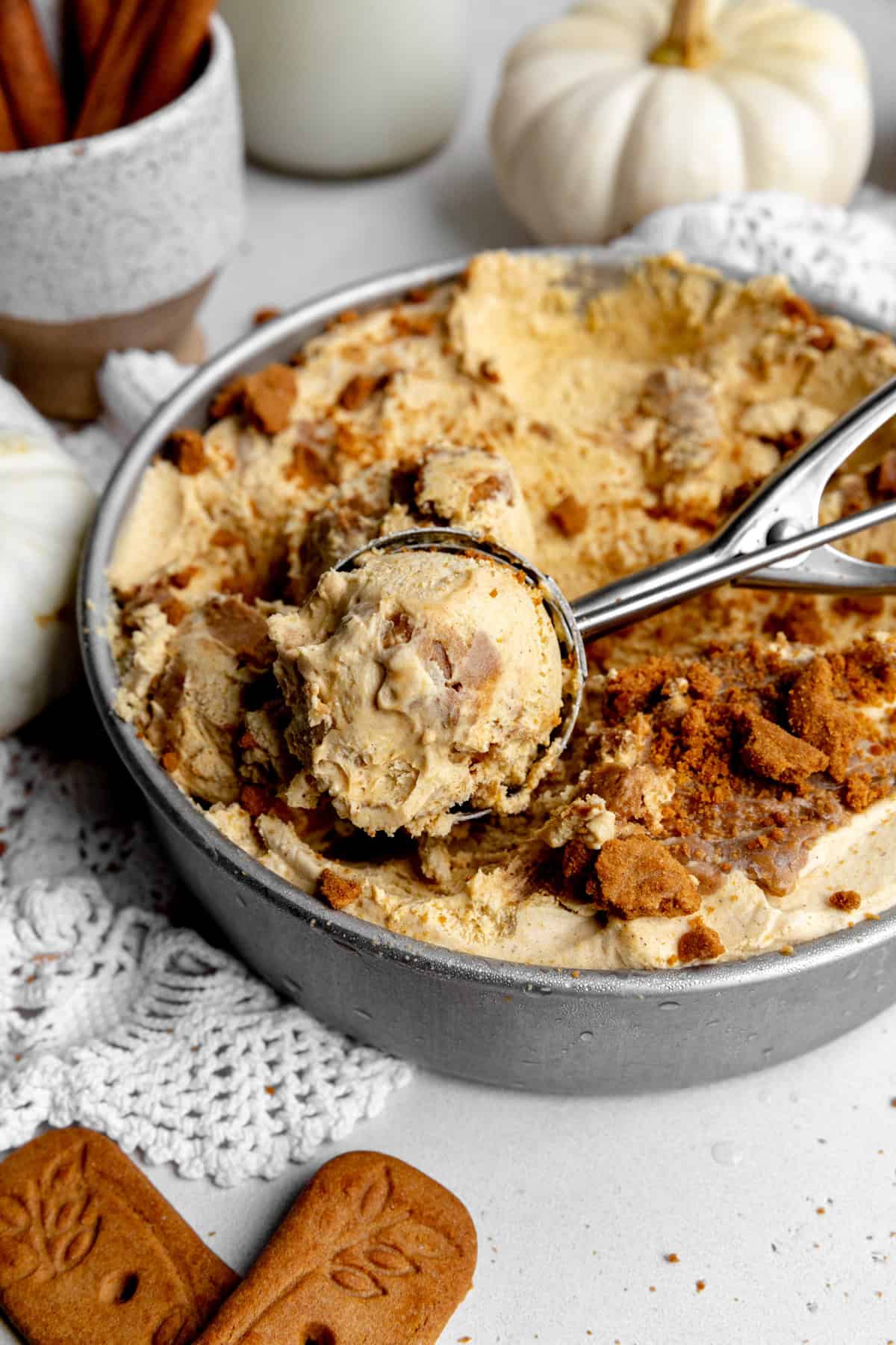 Ice cream scoop full of pumpkin spice ice cream.