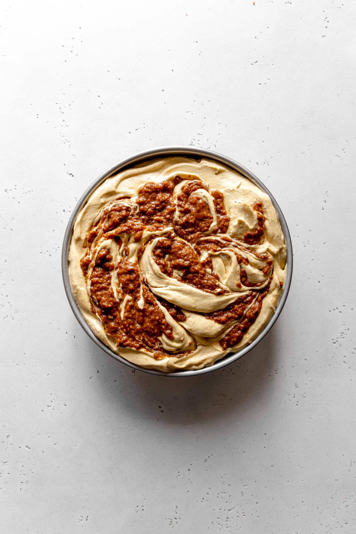 Unset pumpkin spice ice cream in a round cake pan.