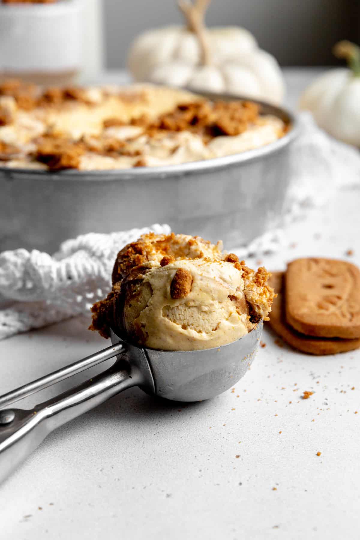 Ice cream scoop full of pumpkin spice ice cream.