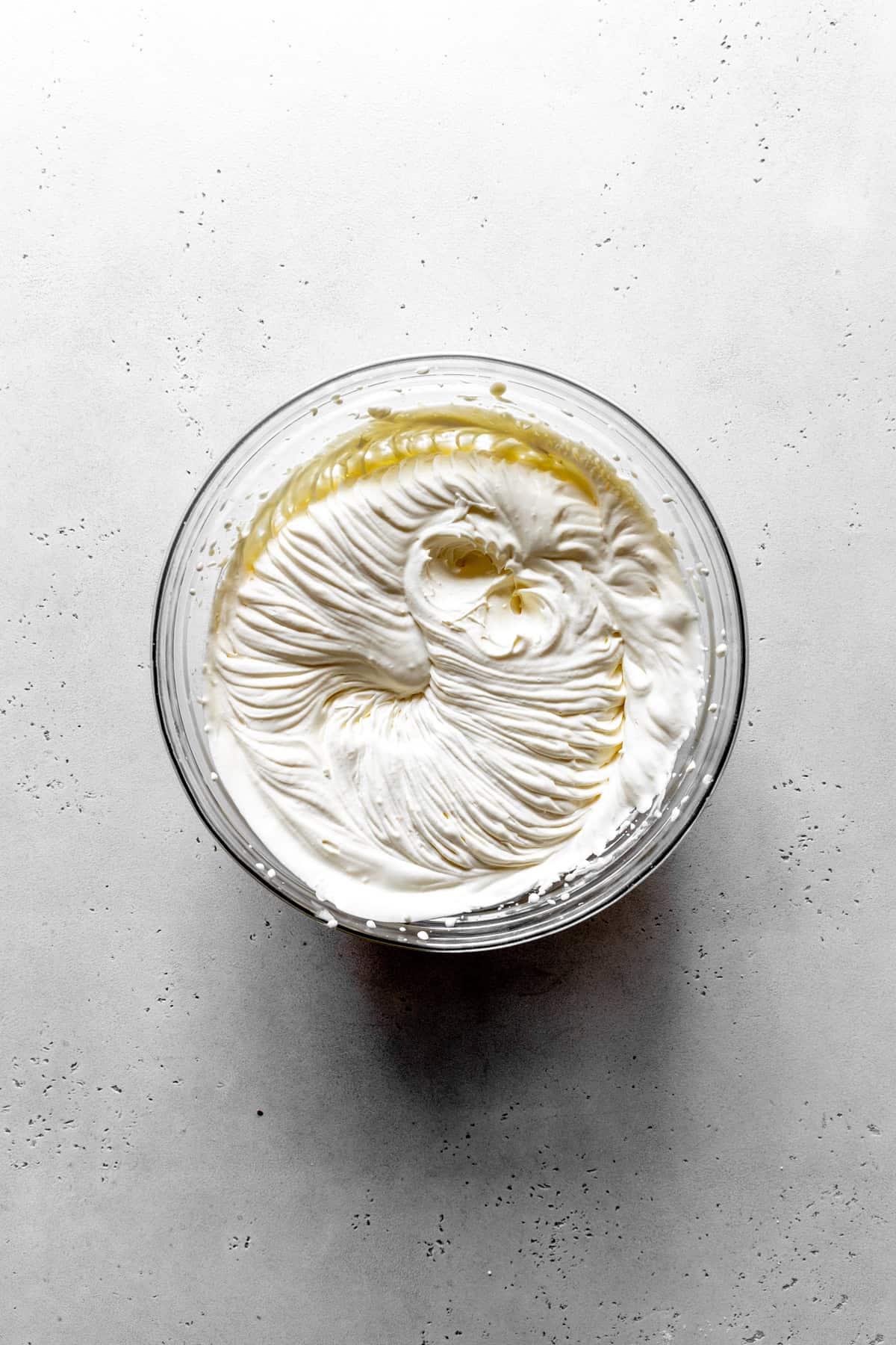 Glass bowl of whipped cream.