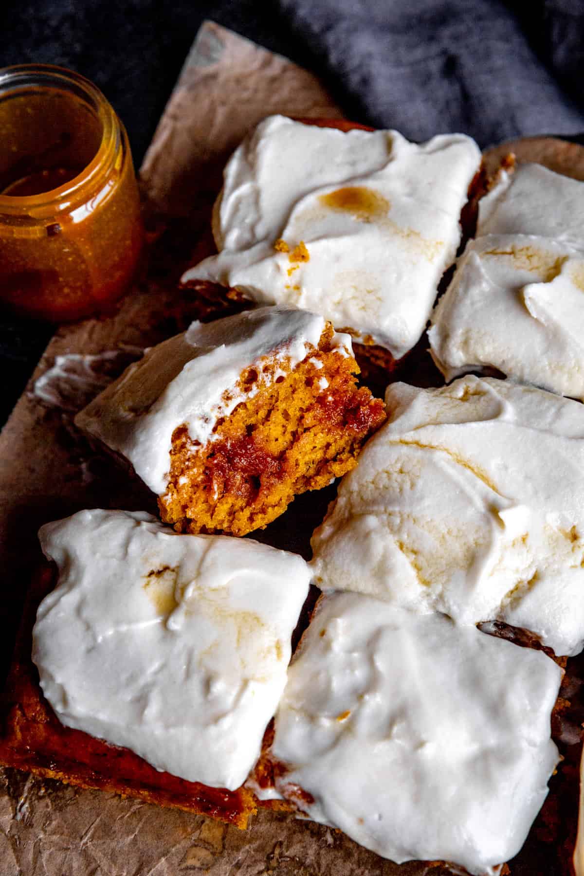 Pumpkin cake squares and a jar of caramel sauce.