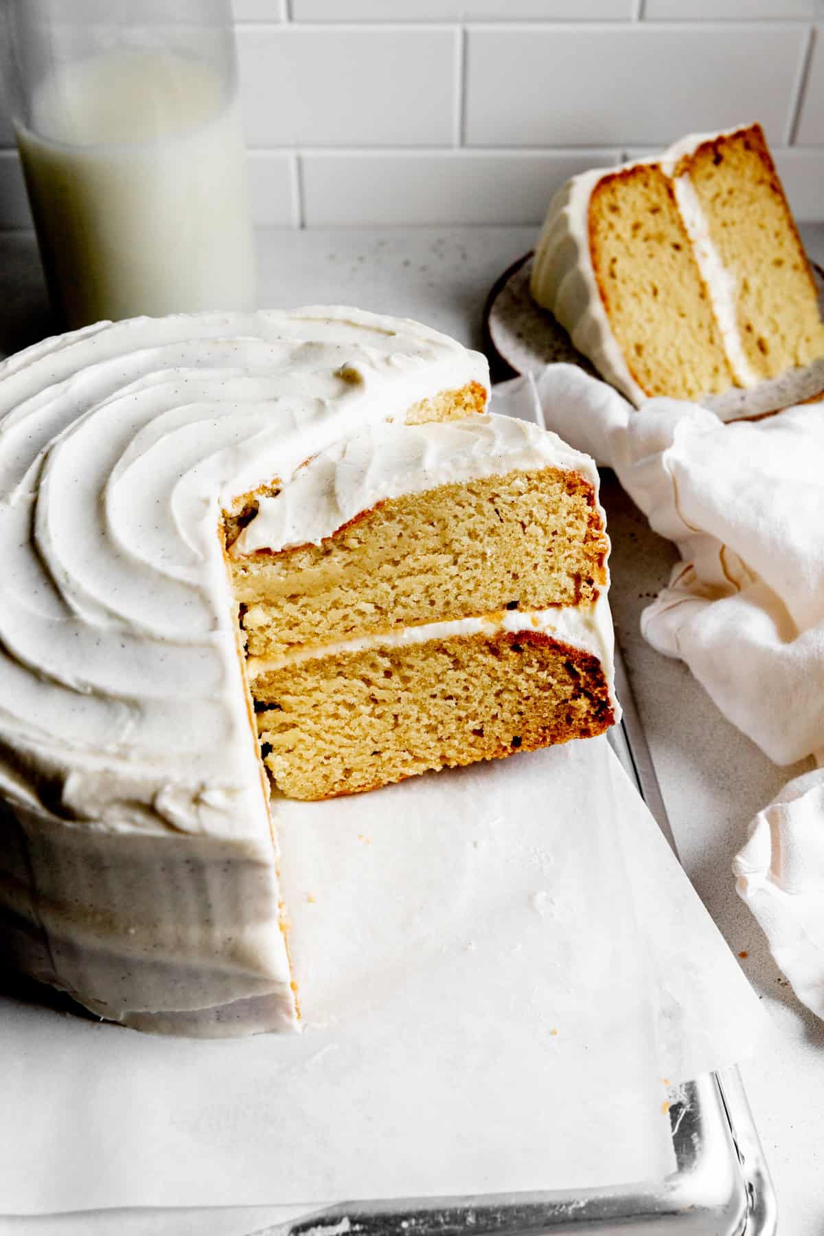 Vanilla cake being sliced.