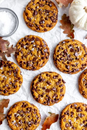 Pumpkin chocolate chip cookies, a white pumpkin and a cup of sea salt.