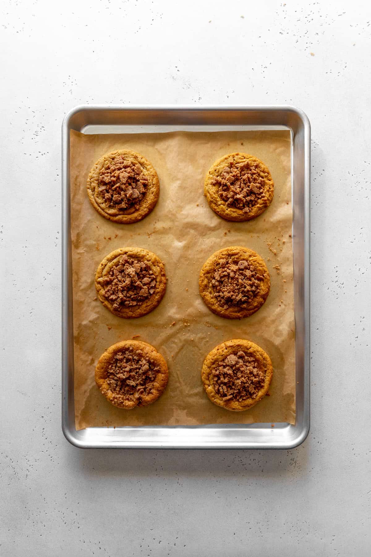 Baked pumpkin coffee cake cookies on a baking sheet.
