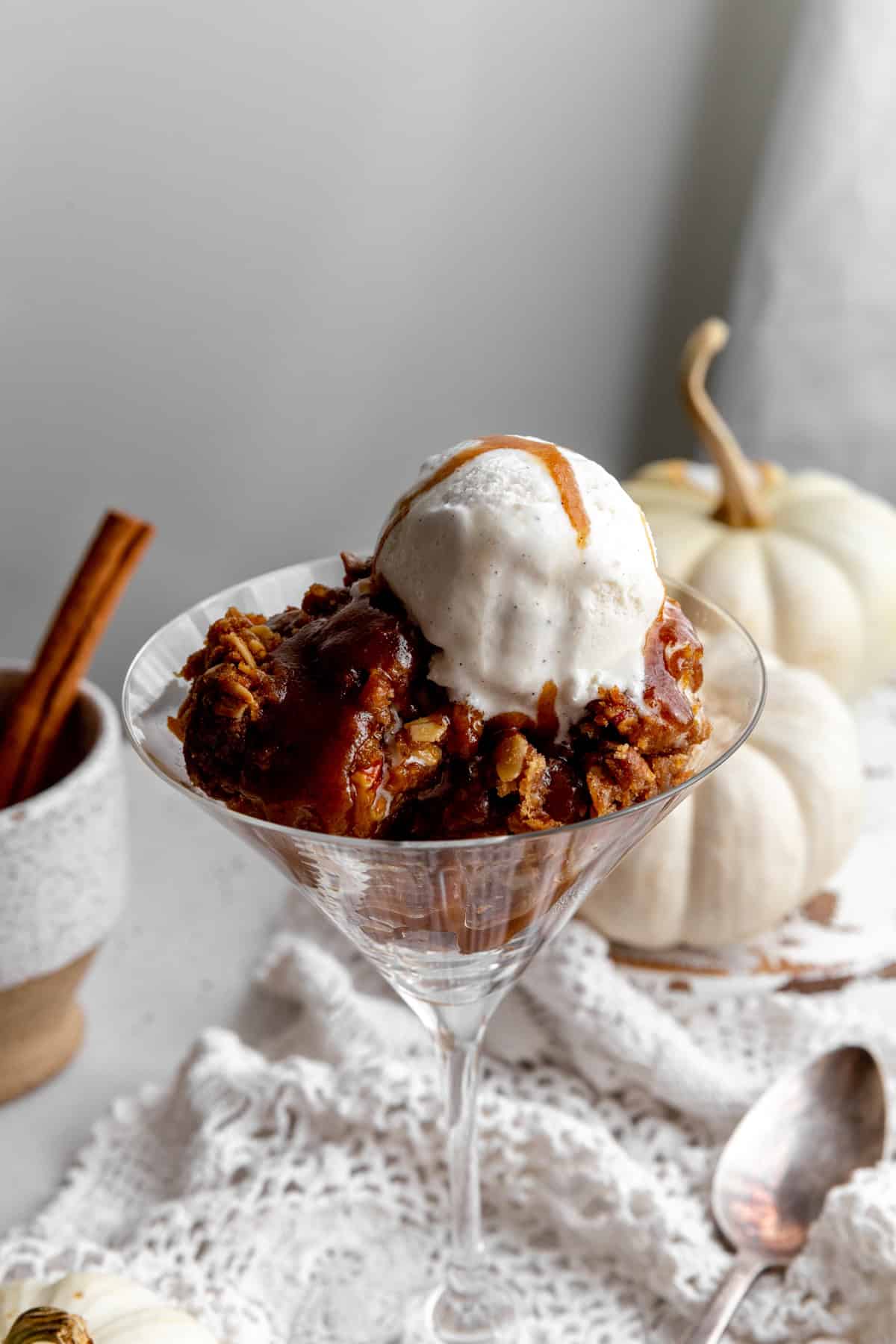 Pumpkin crisp topped with vanilla ice cream.